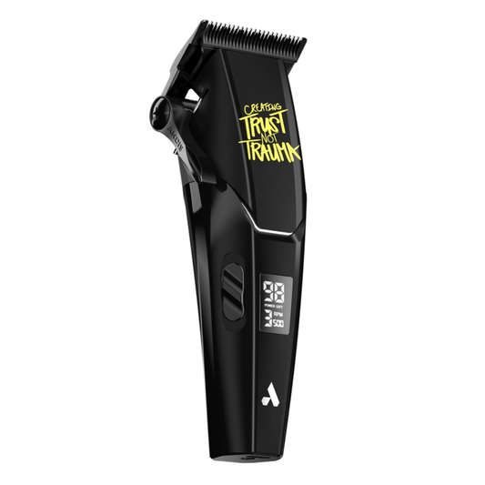 side view of Black hair clipper with digital display with yellow text "CREATING TRUST NOT TRAUMA" on a white background