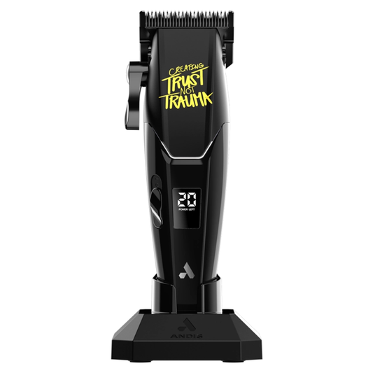 Black hair clipper with digital display  with yellow text "CREATING TRUST NOT TRAUMA" on a white background