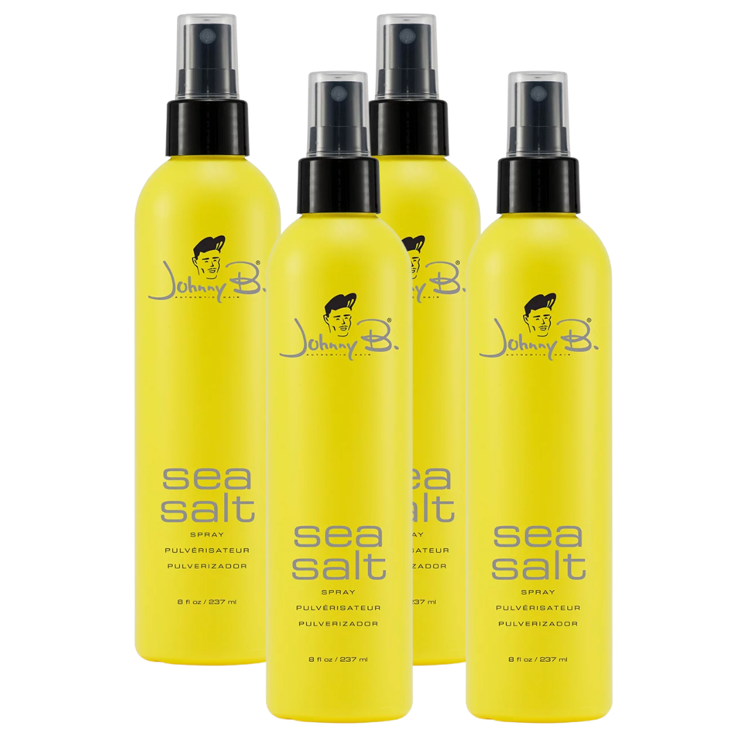 Four Yellow bottles side by side that reads Johnny B Sea Salt spray with a black pump sprayer and clear pump lid on a white background