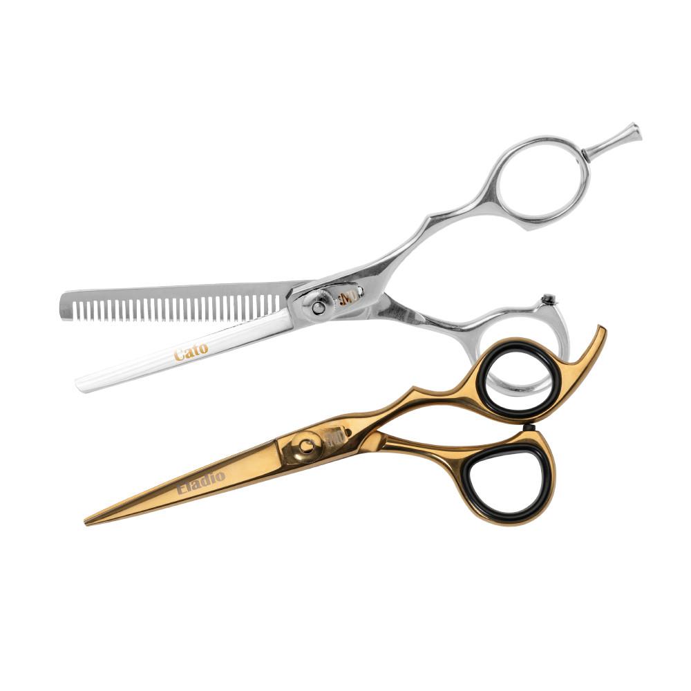 Two professional hairdressing scissors on a white background: one silver with thinning combs and the other gold with black handles.