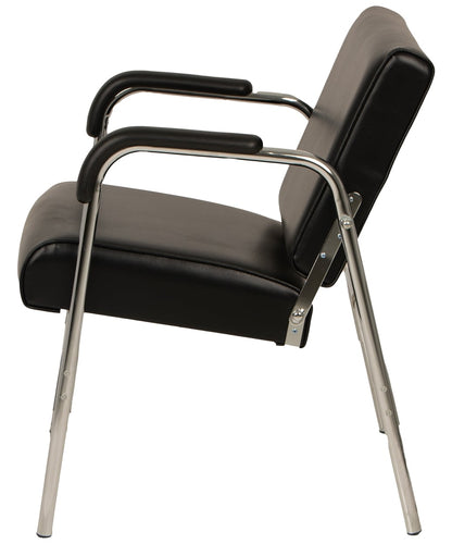 A modern Black shampoo chair armchair with a chrome tubular metal frame and legs, shown from a three-quarters angle on a white background.